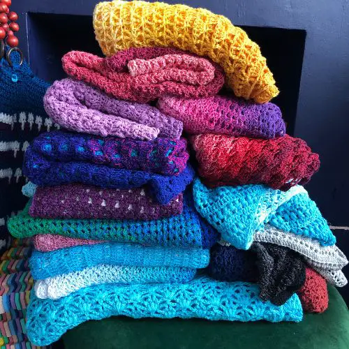 Crochet Wraps and Shawls stack of samples from my crochet wrap patterns